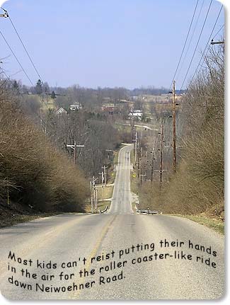 Most kids can't resist putting their hands in the air for the roller coaster-like ride down Neiwoehner Road.