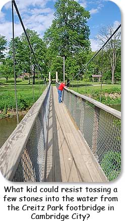 What kid could resist tossing a few stones into the water from teh Creitz Park footbridge in Cambridge City?
