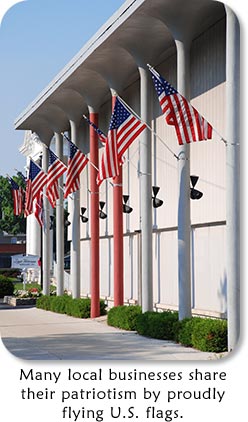 Many local businesses share their patriotism by proudly flying U.S. flags.
