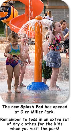 Photo: Children playing in water.  Text: The new Splash Pad has opened at Glen Miller Park.  Remember to toss in an extra set of dry clothes for the kids when you visit the park!