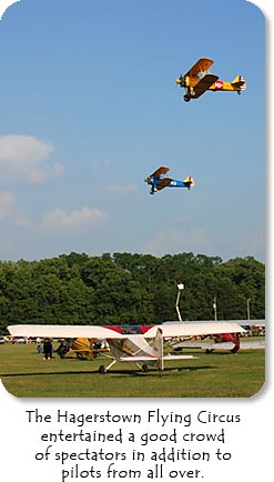 Photo: Two Stearman biplanes fly over Hagerstown Airport.  Text: The Hagerstown Flying Circus entertained a good crowd of spectators in addition to pilots from all over.