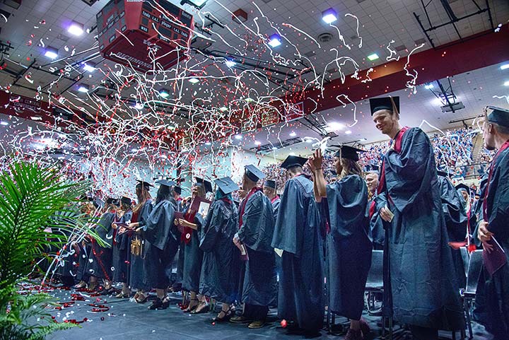 Supplied Photo: Graduates in gowns and caps with lots of confetti.