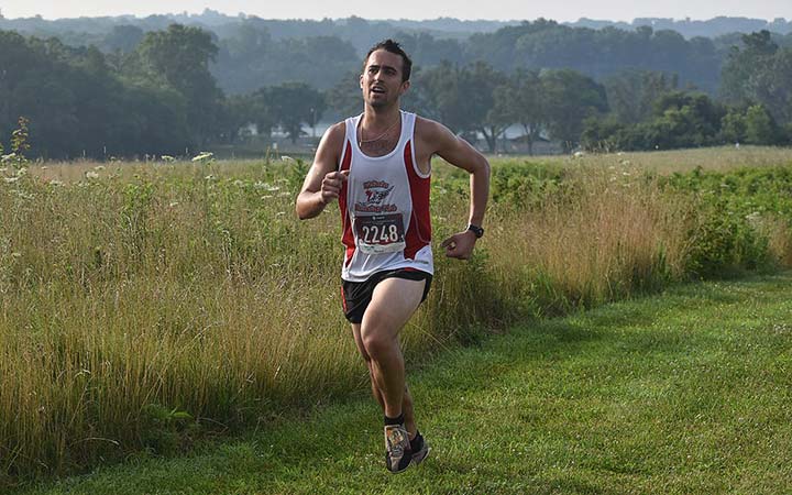 Supplied Photo: Adam Mengel participates in IU East's Run with the Wolves 5K on July 20. He was the overall winner of the race. Mengel is the head coach of IU East's cross country teams.