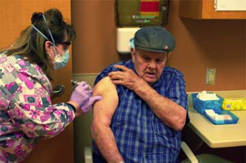 Supplied Photo:  Bob Anthony (right) was the first person to get a COVID-19 vaccination at Reid Health's Greenville, Ohio, facility in a partnership with other local health organizations.