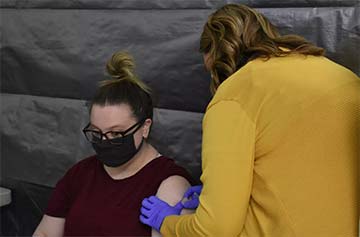 Supplied Photo:  Catherine Cates (left) receives the COVID-19 vaccine at Reid Health's clinic in Brookville, Ind.