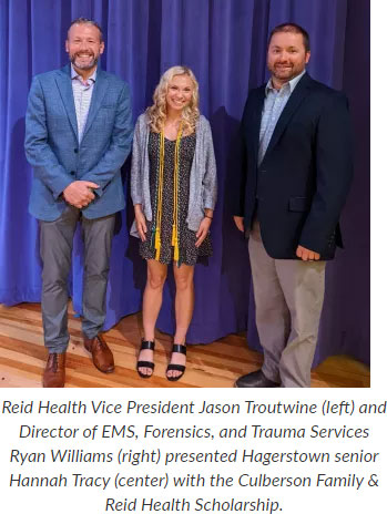 Supplied Photo:  Reid Health Vice President Jason Troutwine and Ryan Williams present Hannah Tracy with the Culberson Family & Reid Health Scholarship