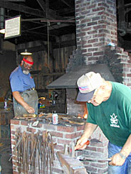 Blacksmiths demonstrate an early trade.