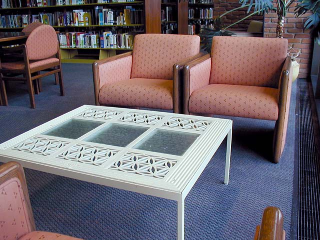 Photo: Low table created from historic wrought iron and glass flooring at the original Morrisson-Reeves Library.