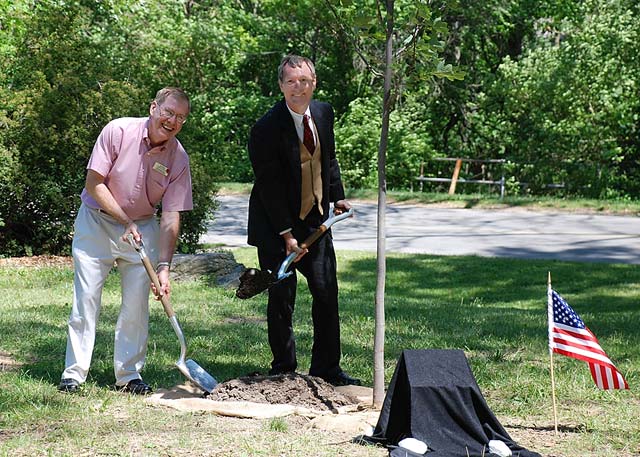 Photo: Jim Resch and Dr. Benjamin Harrison Walker plant new tulip poplar tree in Glen Miller Park.