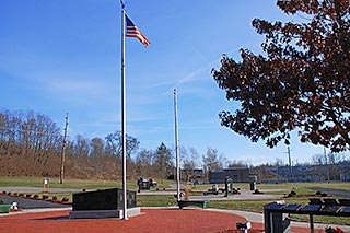 Flag flies over memorials at Veterans Memorial Park