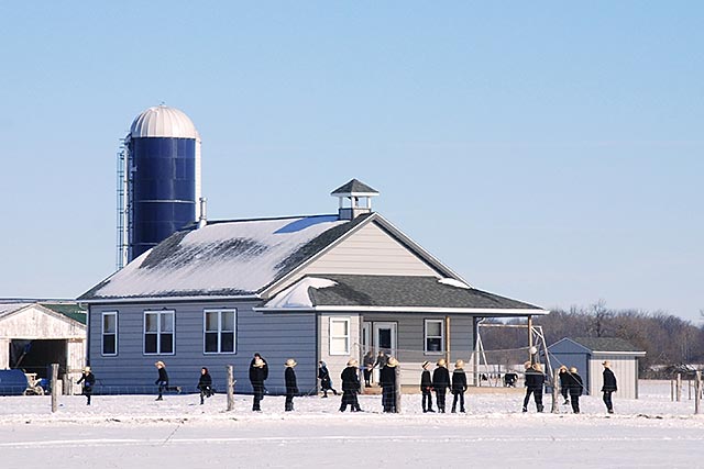 Amish school house with children playing during recess. Click to view on Flickr.